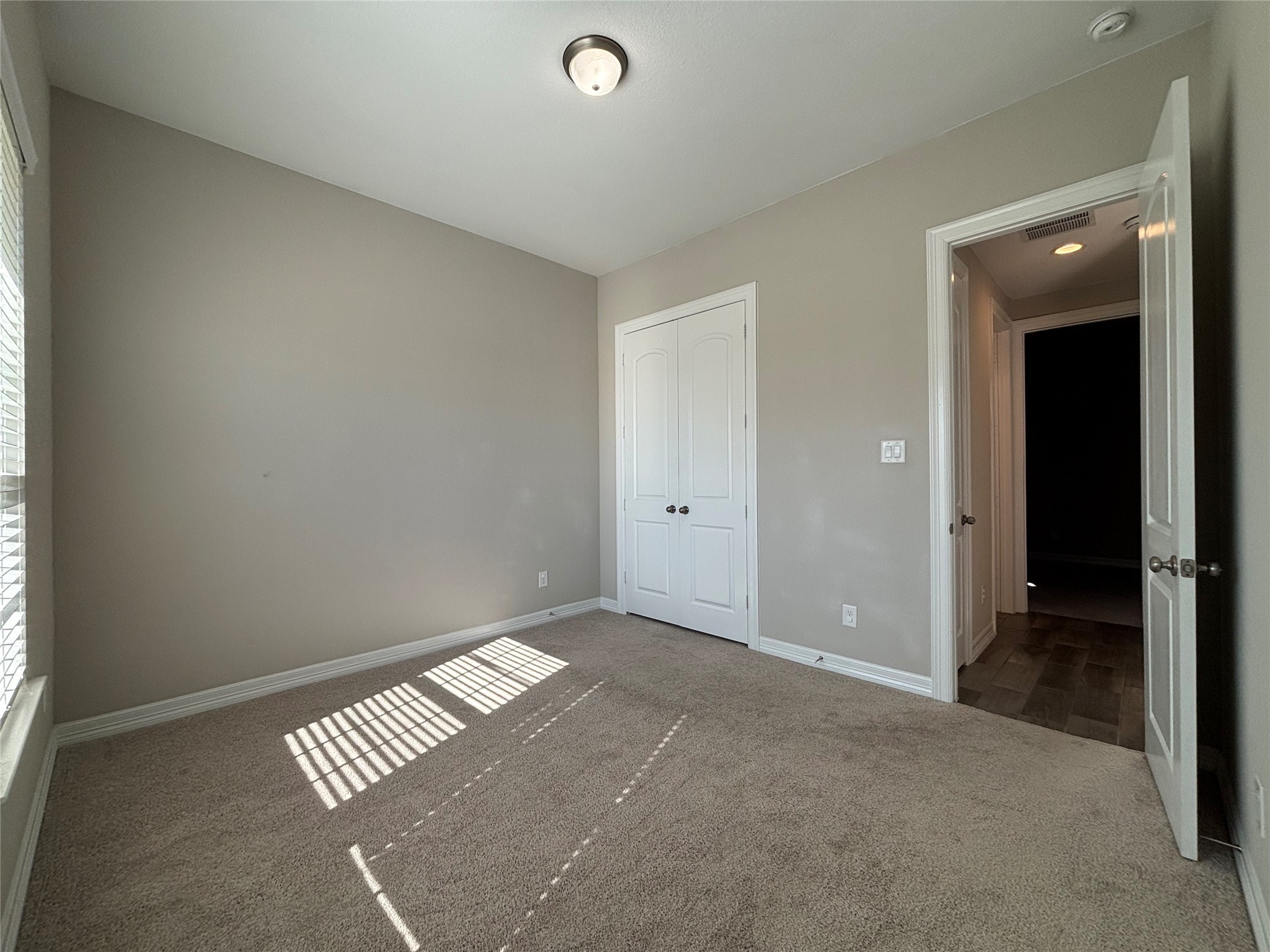20826 Stonebreak Lane Spring, TX 77379 - Photo 3 of 37 an empty room with wooden floor and windows
