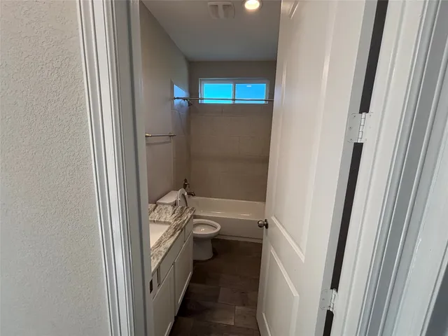 a bathroom with a sink and toilet