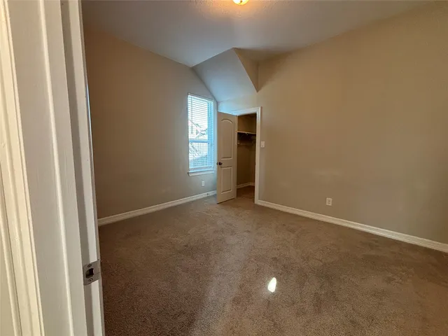 an empty room with a empty space and window