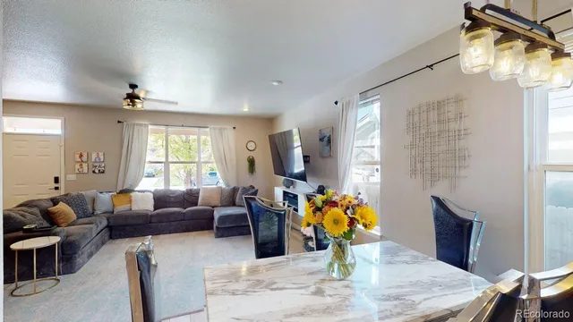 a living room with fireplace furniture and a wooden floor