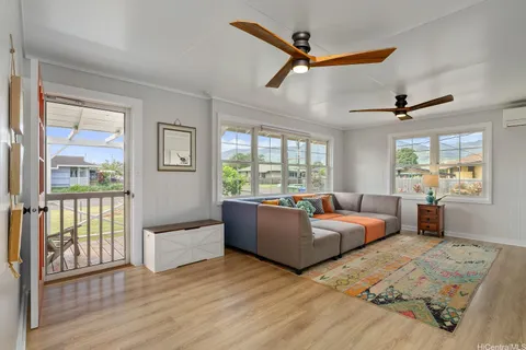 a living room with furniture and a window
