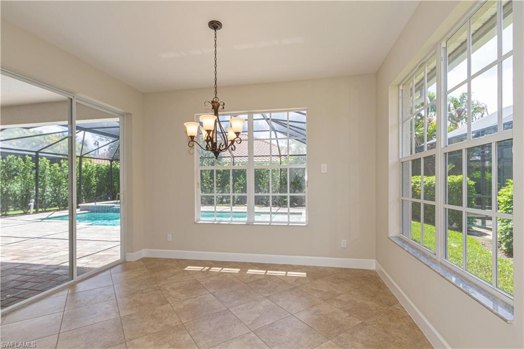 9172 Quartz Lane Naples, FL 34120 - Photo 11 of 25 a view of an empty room with windows