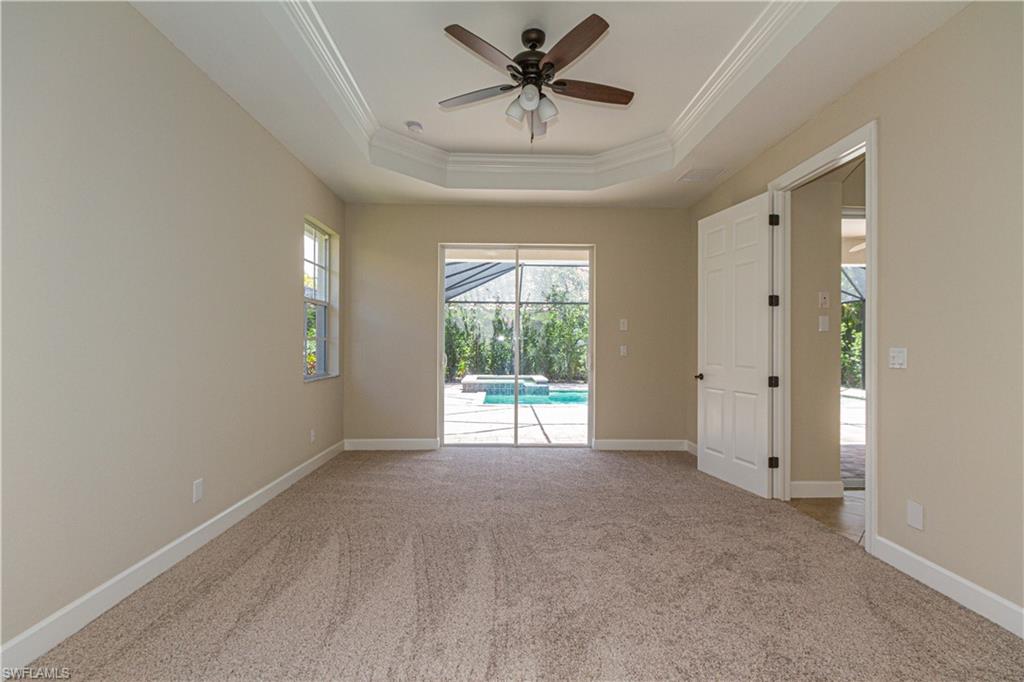9172 Quartz Lane Naples, FL 34120 - Photo 13 of 25 a view of a livingroom with a ceiling fan and window