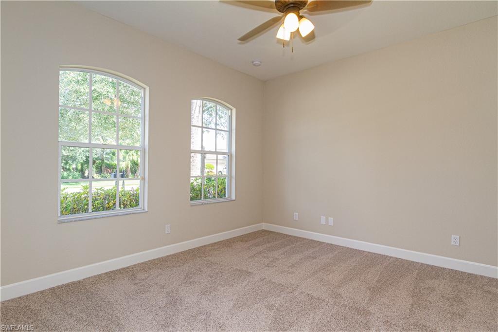 9172 Quartz Lane Naples, FL 34120 - Photo 14 of 25 an empty room with a window
