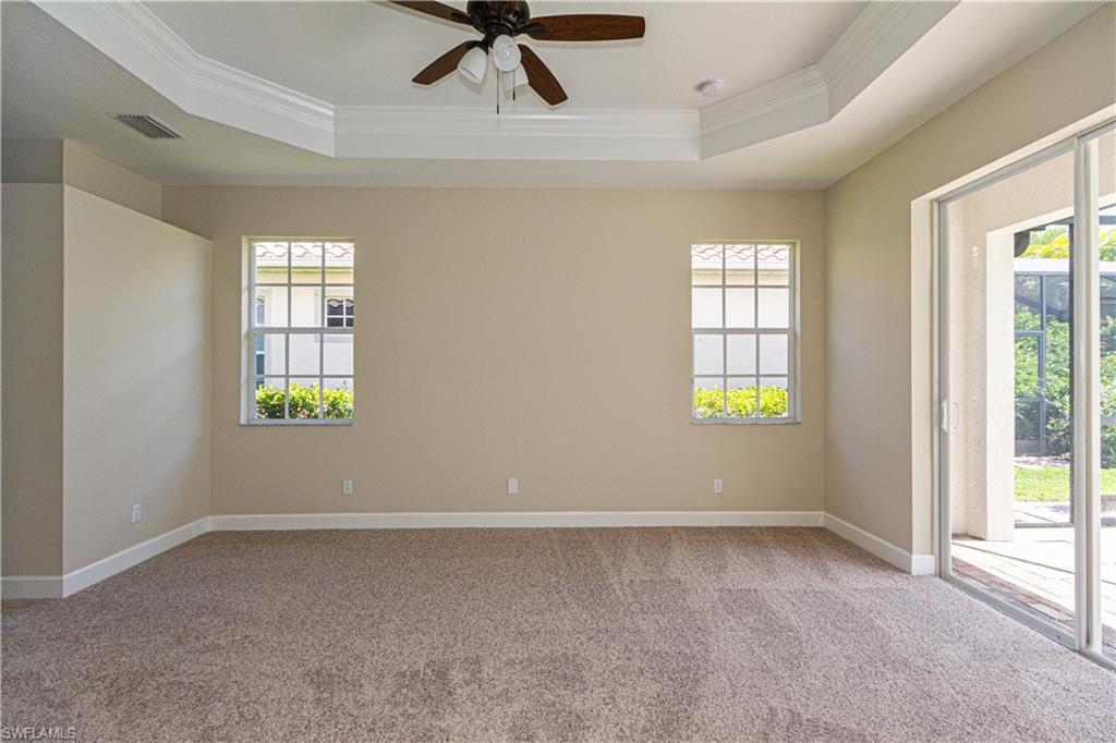 9172 Quartz Lane Naples, FL 34120 - Photo 15 of 25 a view of an empty room with a window