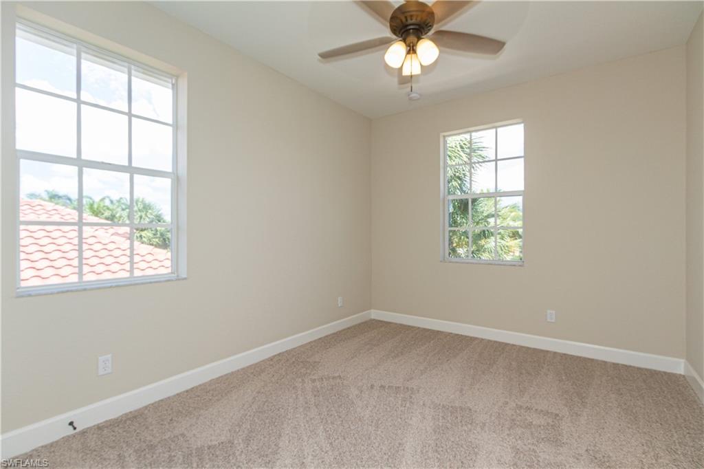 9172 Quartz Lane Naples, FL 34120 - Photo 16 of 25 an empty room with a window