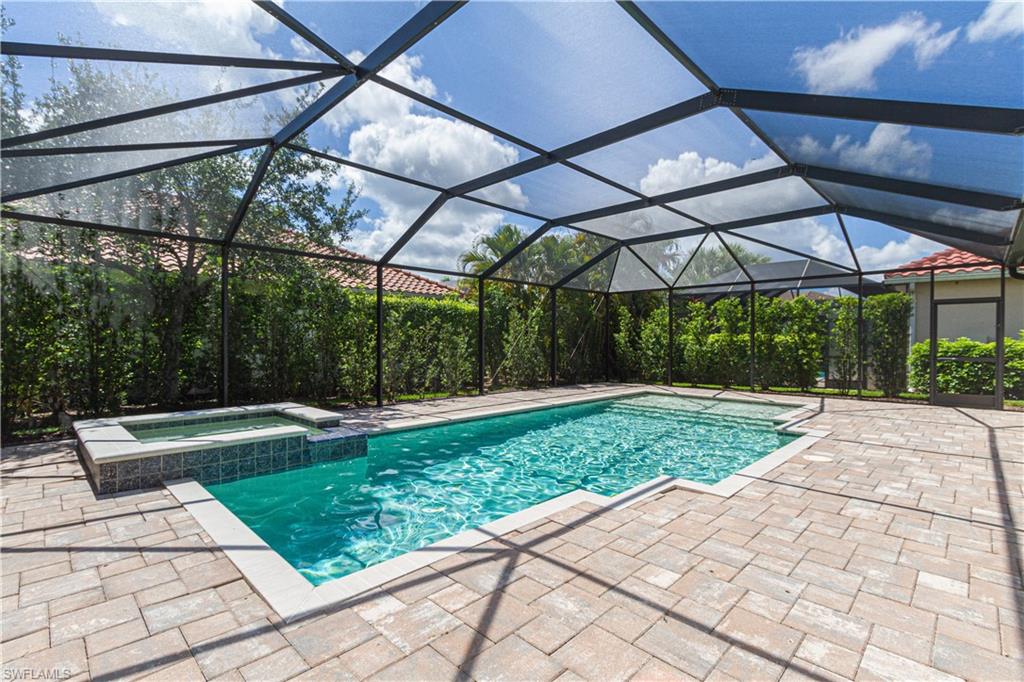 9172 Quartz Lane Naples, FL 34120 - Photo 3 of 25 a view of yard with a patio and plants