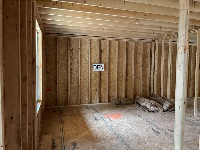 a view of a backyard with wooden fence