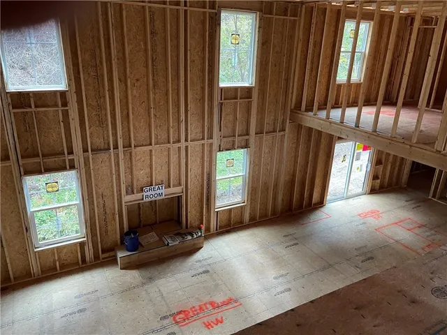 a view of an empty room with a fireplace