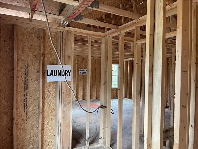 a sign on a wall next to a window