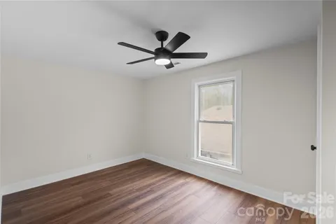 a bathroom with a sink a toilet a vanity and mirror