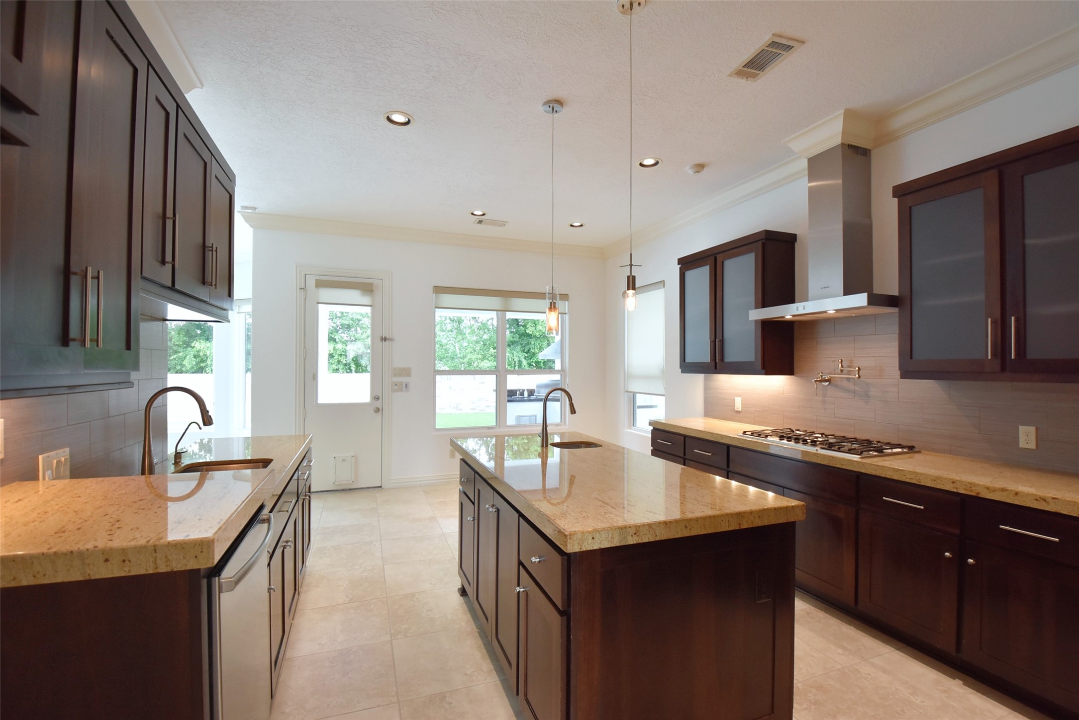 2014 Split Branch Court Houston, TX 77077 - Photo 8 of 47 a kitchen with kitchen island granite countertop a sink stove top oven and refrigerator