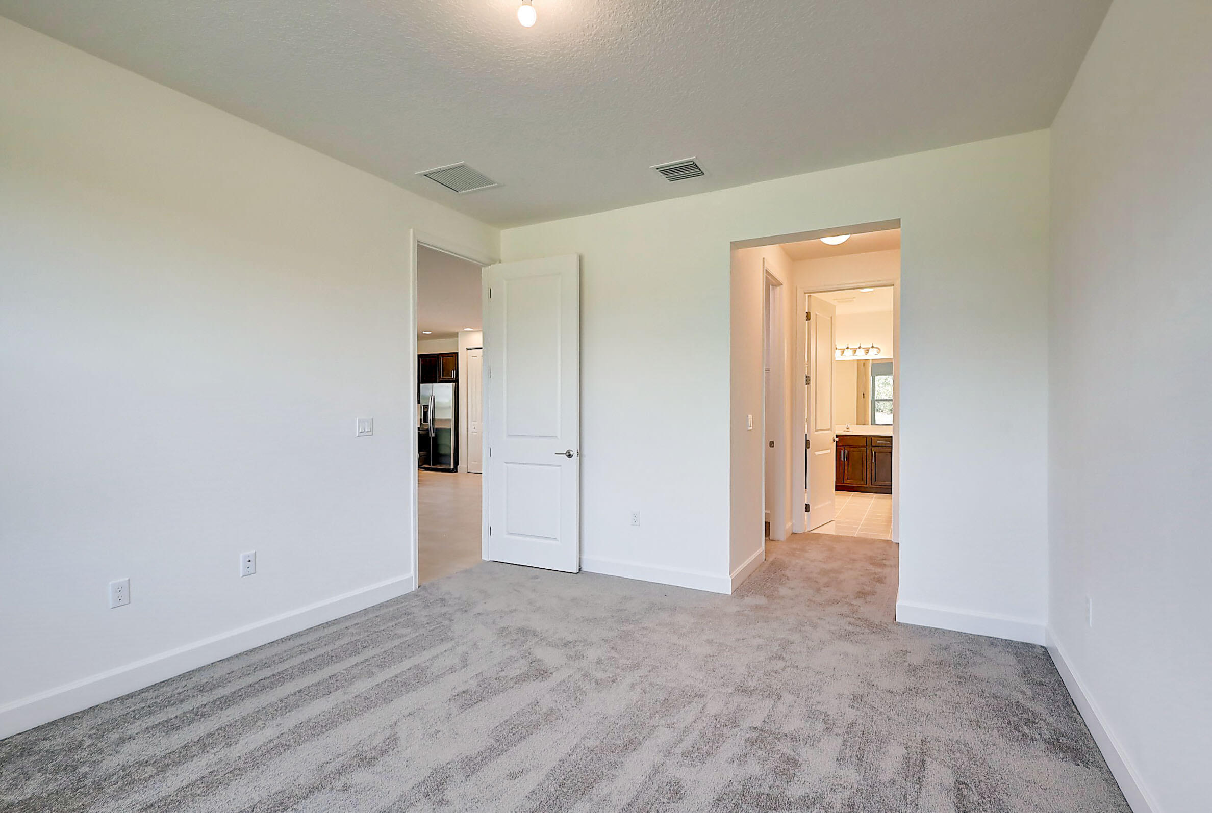 13549 Southwest Oceanus Boulevard Port St. Lucie, FL 34987 - Photo 11 of 30 a view of an empty room and closet area