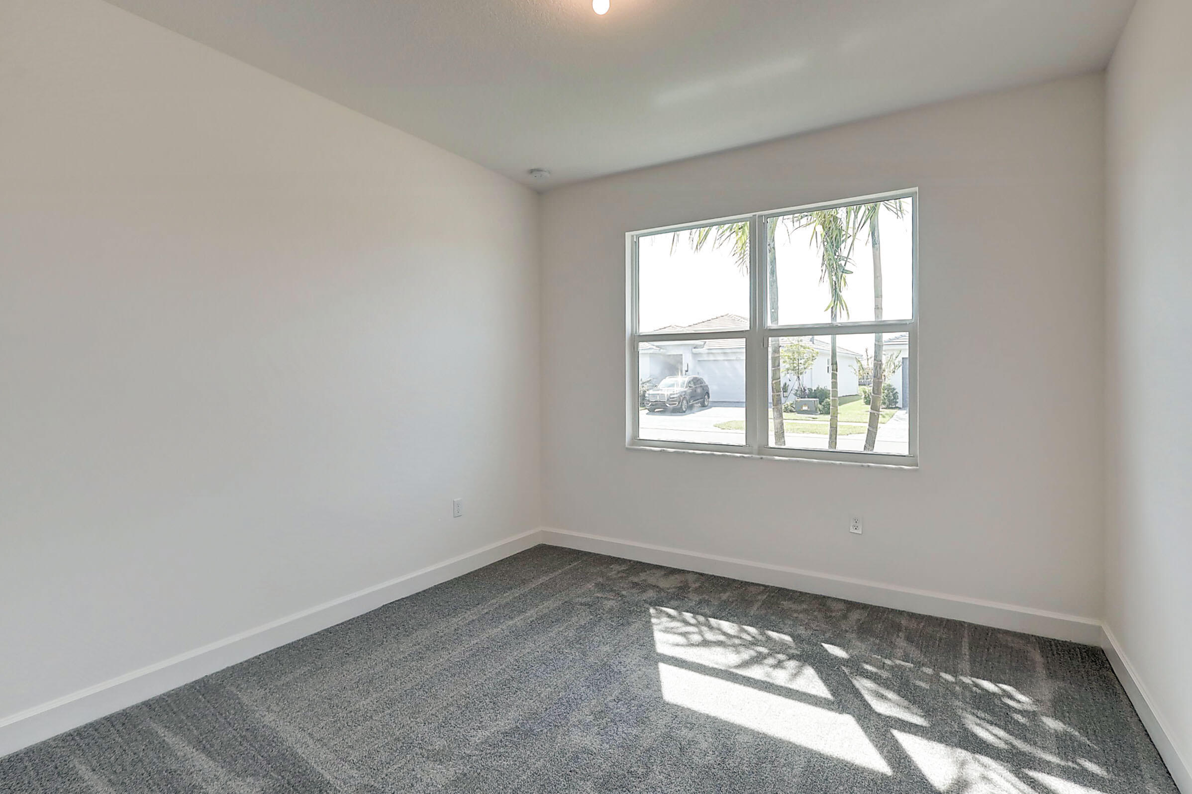13549 Southwest Oceanus Boulevard Port St. Lucie, FL 34987 - Photo 15 of 30 an empty room with a window