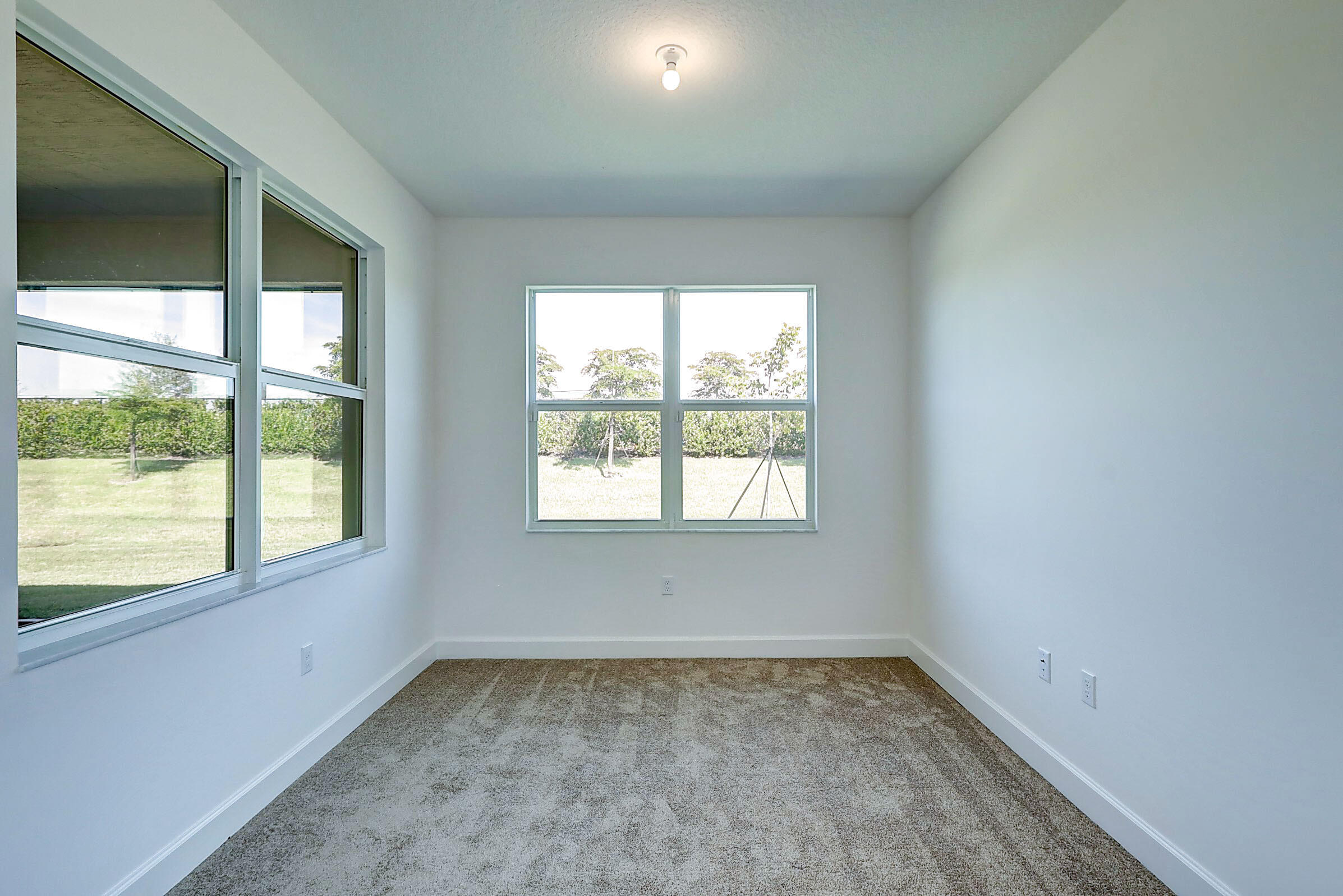 13549 Southwest Oceanus Boulevard Port St. Lucie, FL 34987 - Photo 22 of 30 an empty room with a window