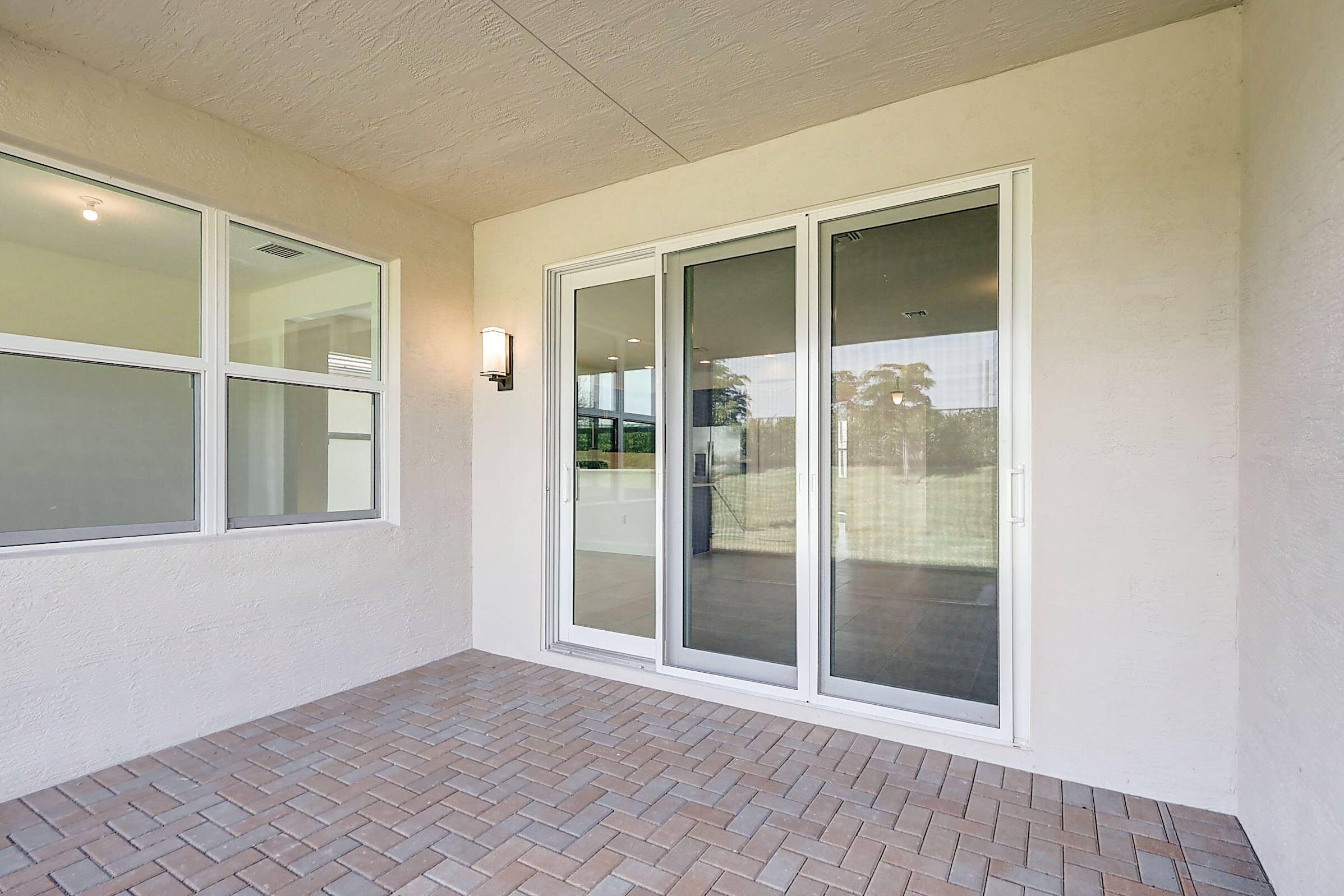 13549 Southwest Oceanus Boulevard Port St. Lucie, FL 34987 - Photo 27 of 30 an empty room with windows