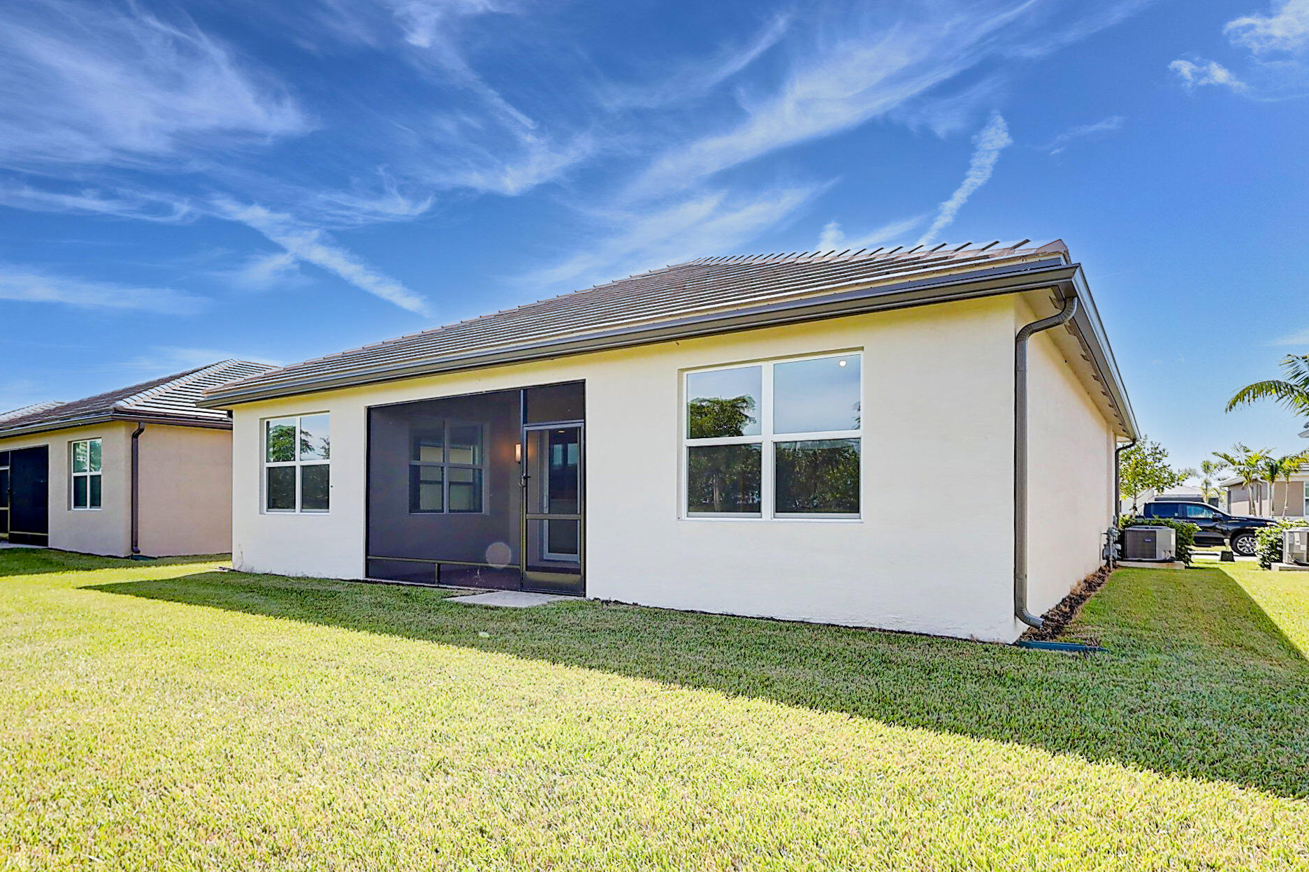 13549 Southwest Oceanus Boulevard Port St. Lucie, FL 34987 - Photo 28 of 30 a view of a house with backyard and garden