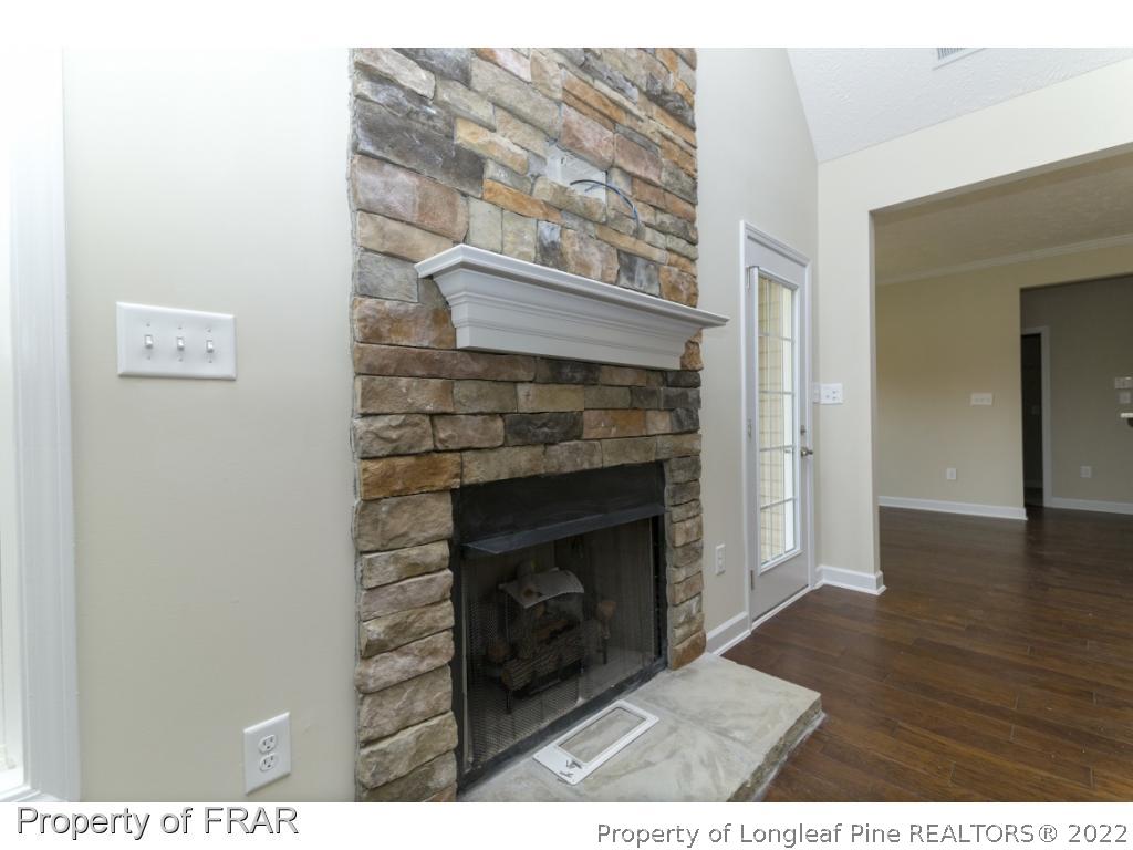 5615 Wade-Stedman Road Wade, NC 28395 - Photo 17 of 36 a living room with a fireplace