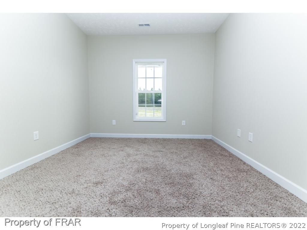 5615 Wade-Stedman Road Wade, NC 28395 - Photo 19 of 36 an empty room with a window