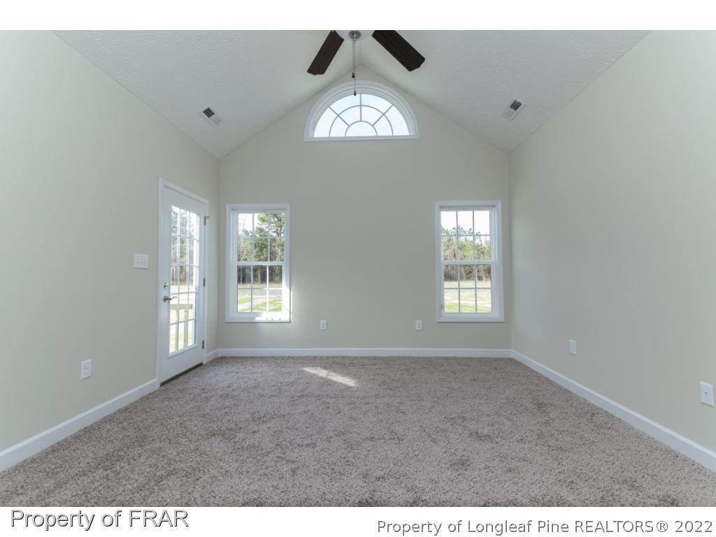 5615 Wade-Stedman Road Wade, NC 28395 - Photo 21 of 36 a view of an empty room and a window