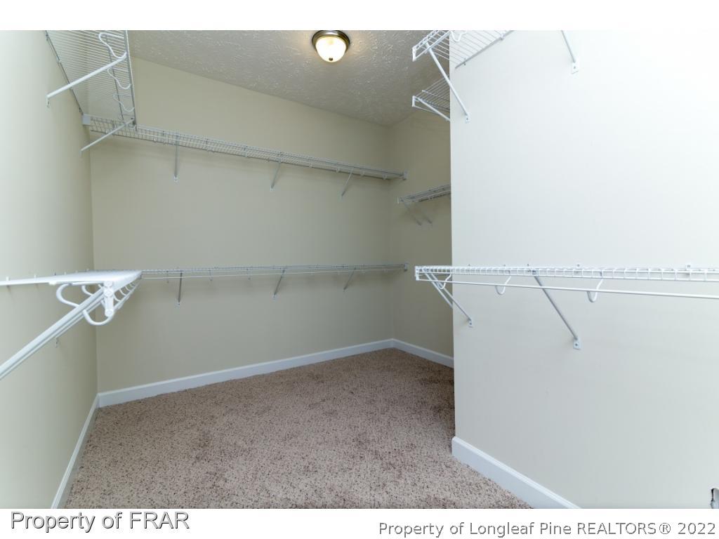 5615 Wade-Stedman Road Wade, NC 28395 - Photo 23 of 36 a view of a room with racks on the wall