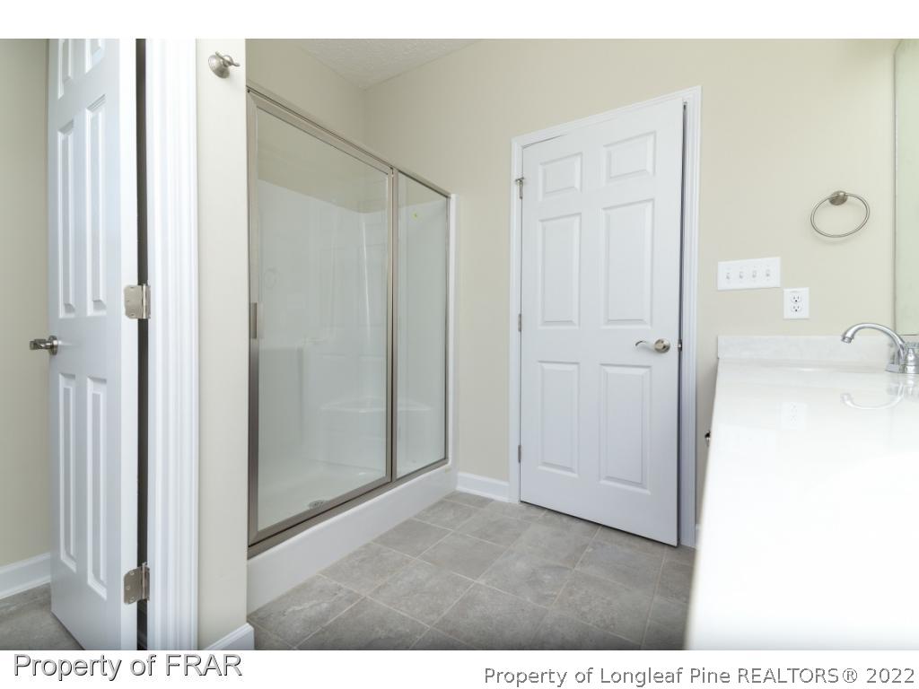 5615 Wade-Stedman Road Wade, NC 28395 - Photo 26 of 36 a view of a bedroom from the hallway