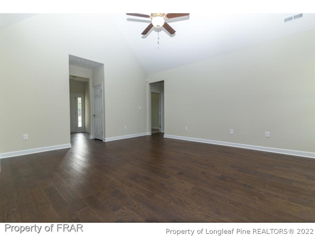 5615 Wade-Stedman Road Wade, NC 28395 - Photo 4 of 36 a view of a room with wooden floor and window