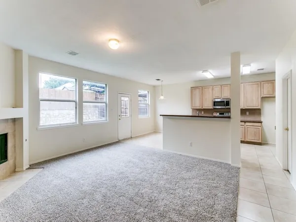 a view of a kitchen with a sink and cabinets