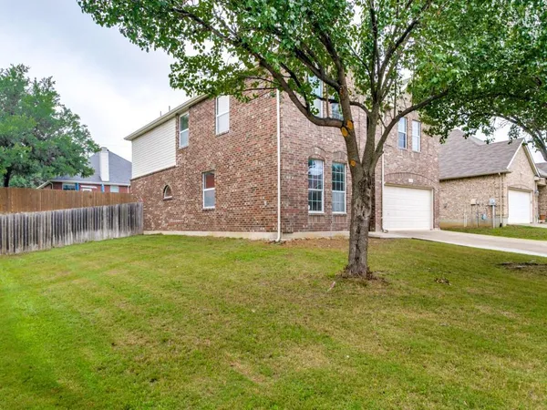 a backyard of a house with lots of green space
