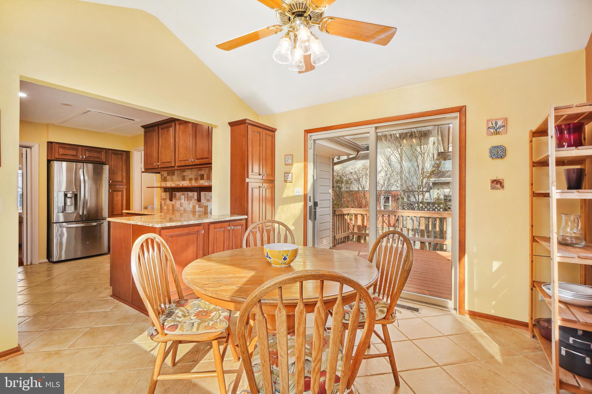9127 Kirkdale Road Bethesda, MD 20817 - Photo 13 of 34 a dining room with furniture and large windows