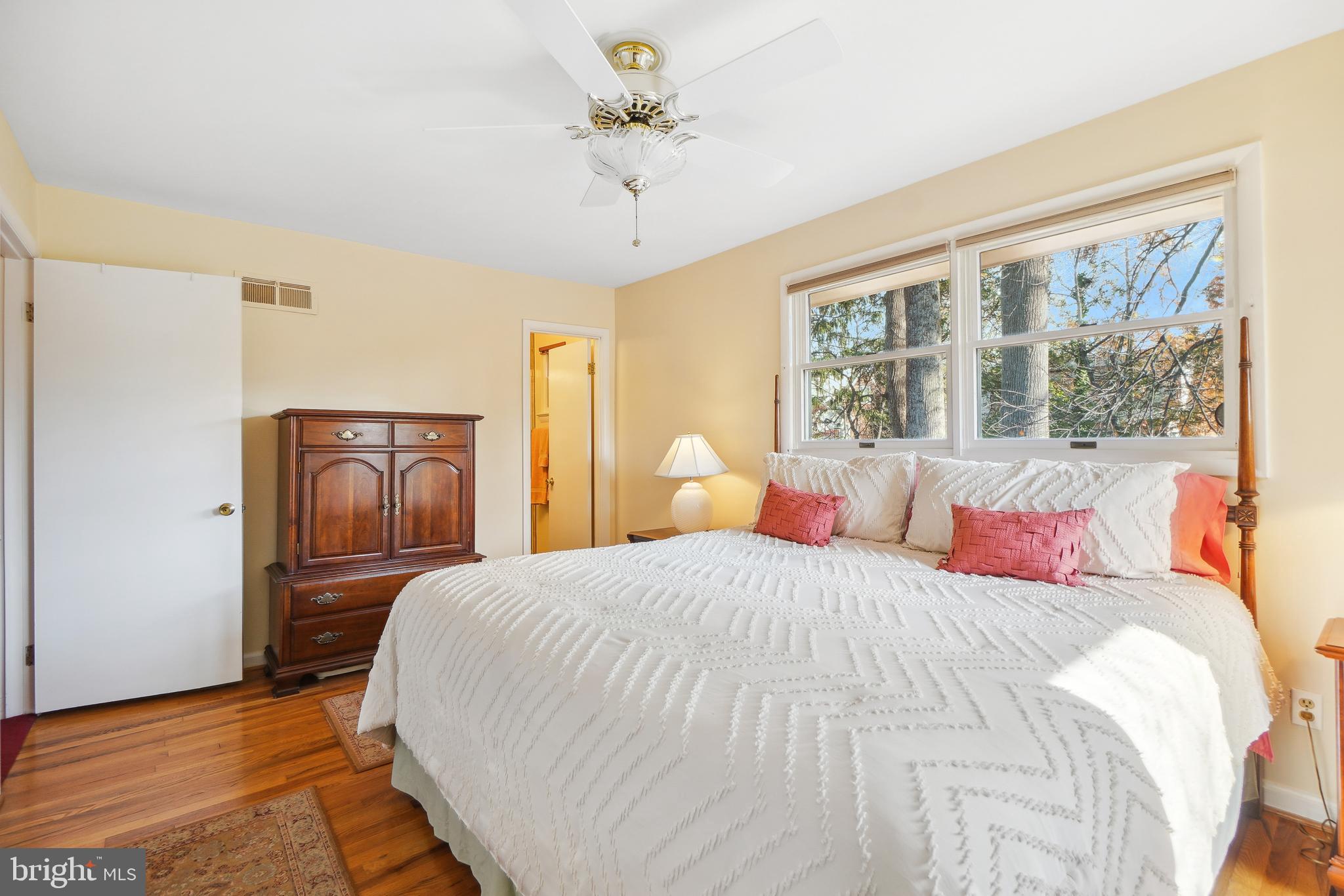 9127 Kirkdale Road Bethesda, MD 20817 - Photo 17 of 34 a bedroom with a balcony a bed and a chandelier