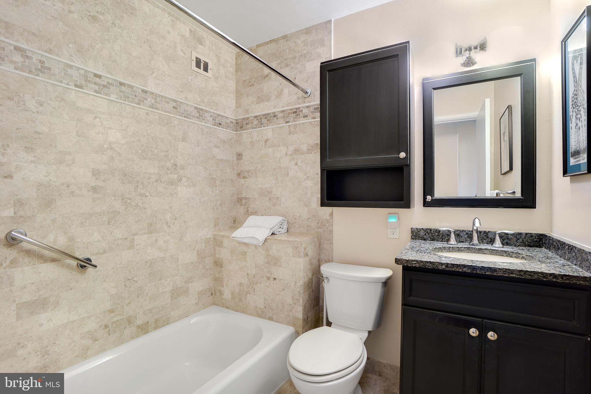 9127 Kirkdale Road Bethesda, MD 20817 - Photo 21 of 34 a bathroom with a toilet a sink and mirror