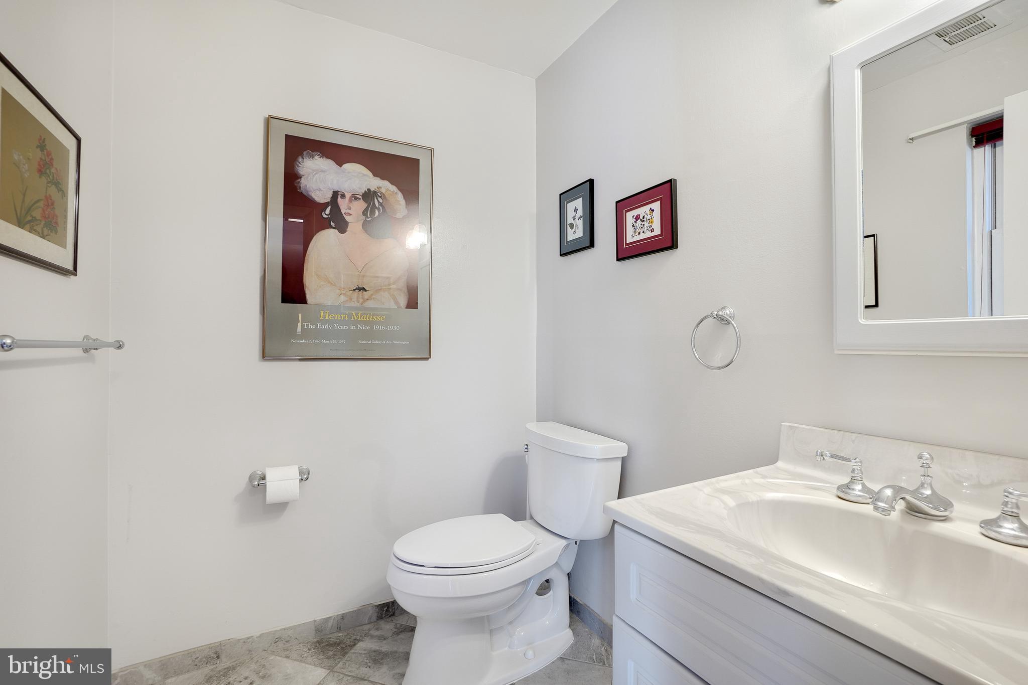 9127 Kirkdale Road Bethesda, MD 20817 - Photo 29 of 34 a bathroom with a toilet a sink and mirror