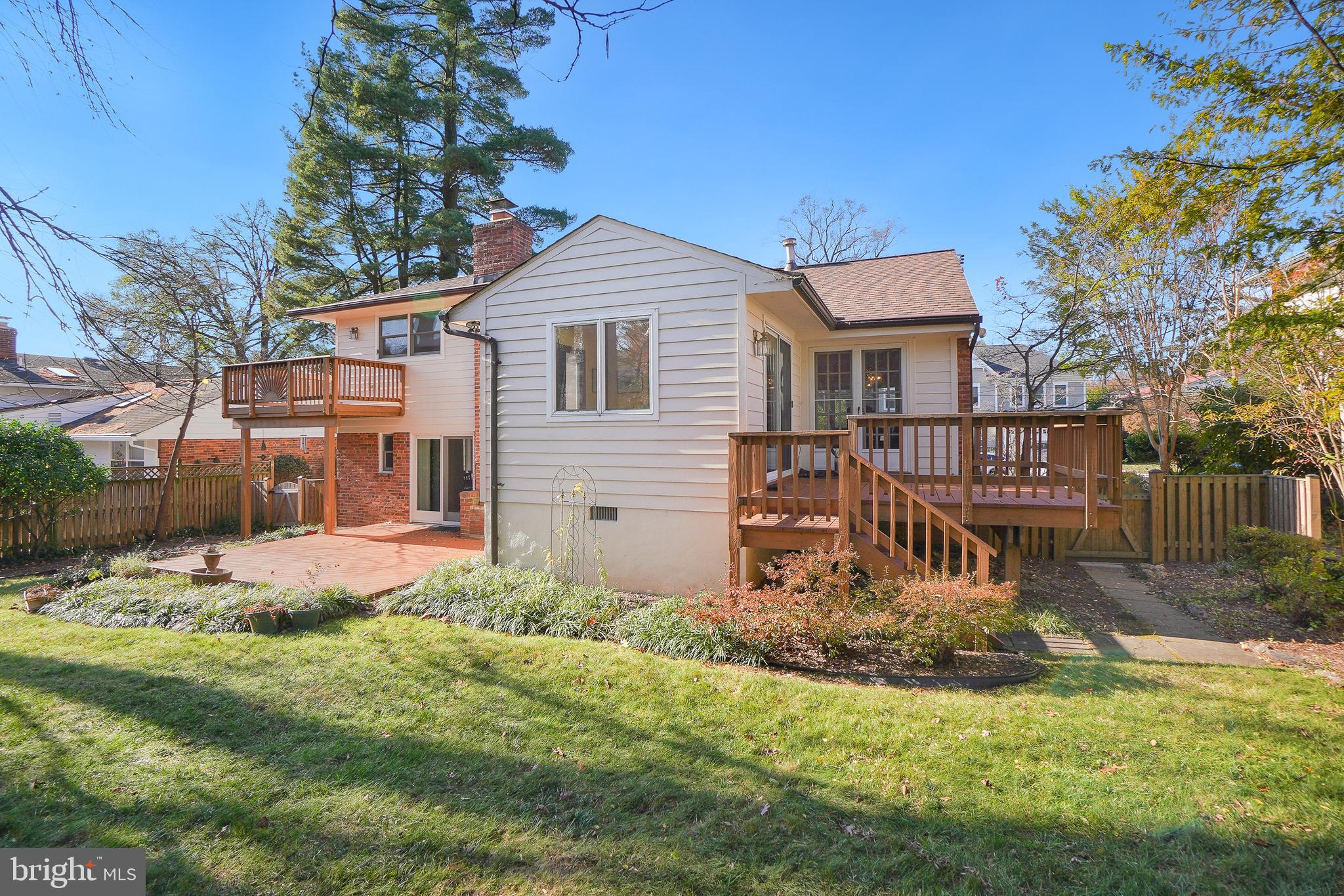 9127 Kirkdale Road Bethesda, MD 20817 - Photo 30 of 34 a view of a house with backyard and sitting area
