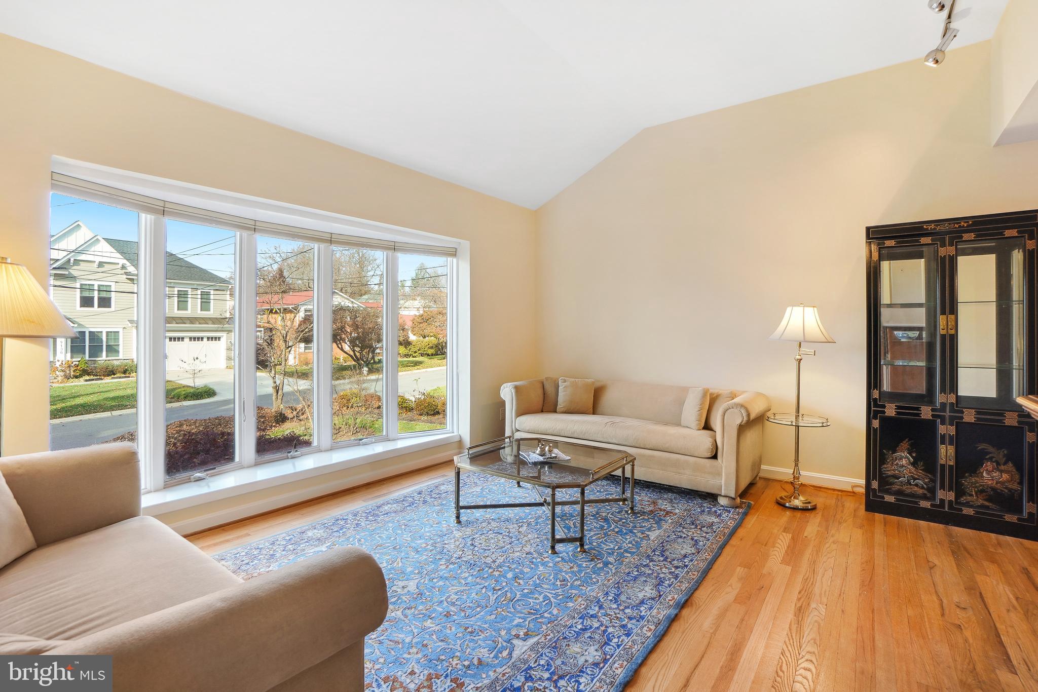 9127 Kirkdale Road Bethesda, MD 20817 - Photo 3 of 34 a living room with furniture and a wooden floor