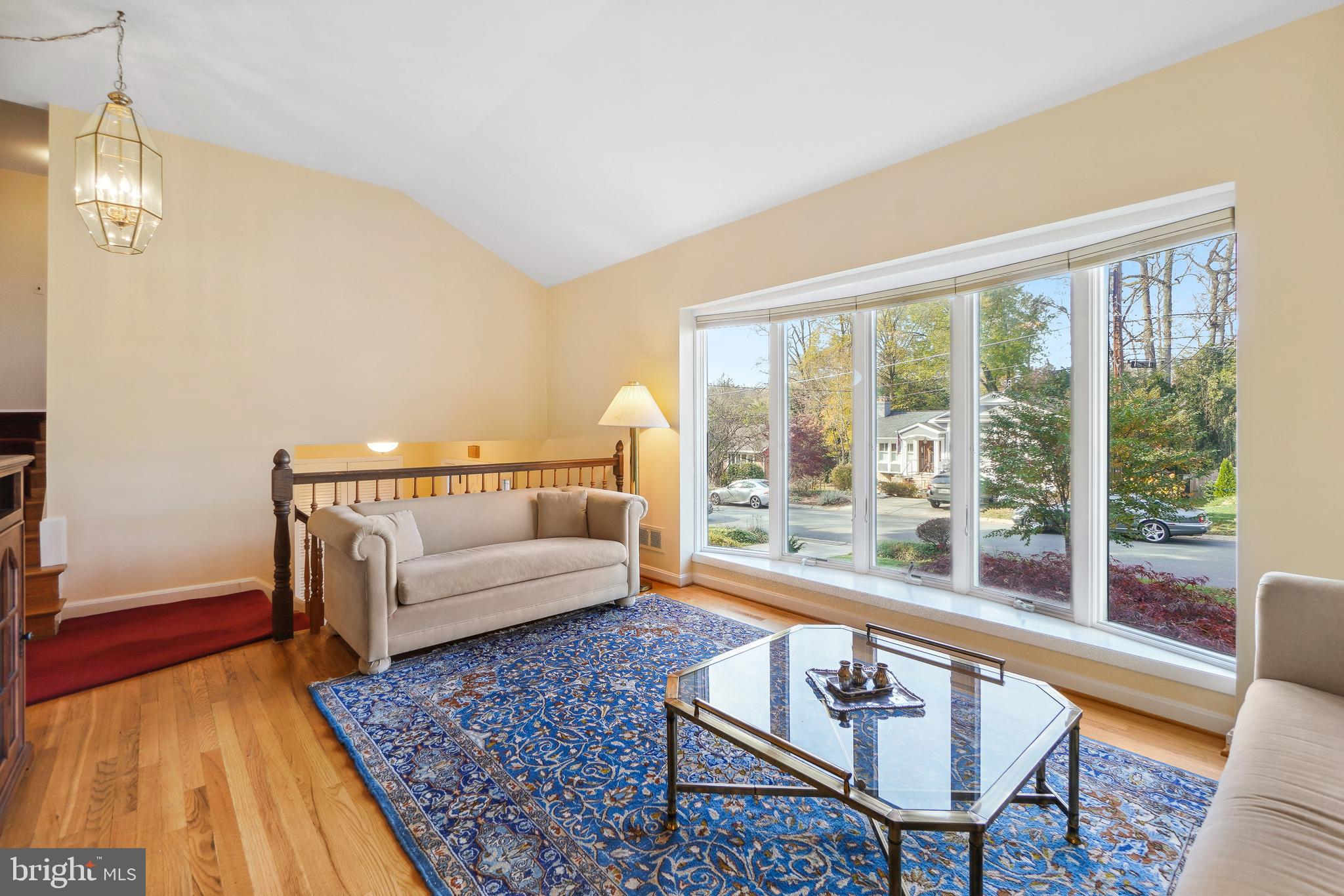 9127 Kirkdale Road Bethesda, MD 20817 - Photo 4 of 34 a living room with couch and a table