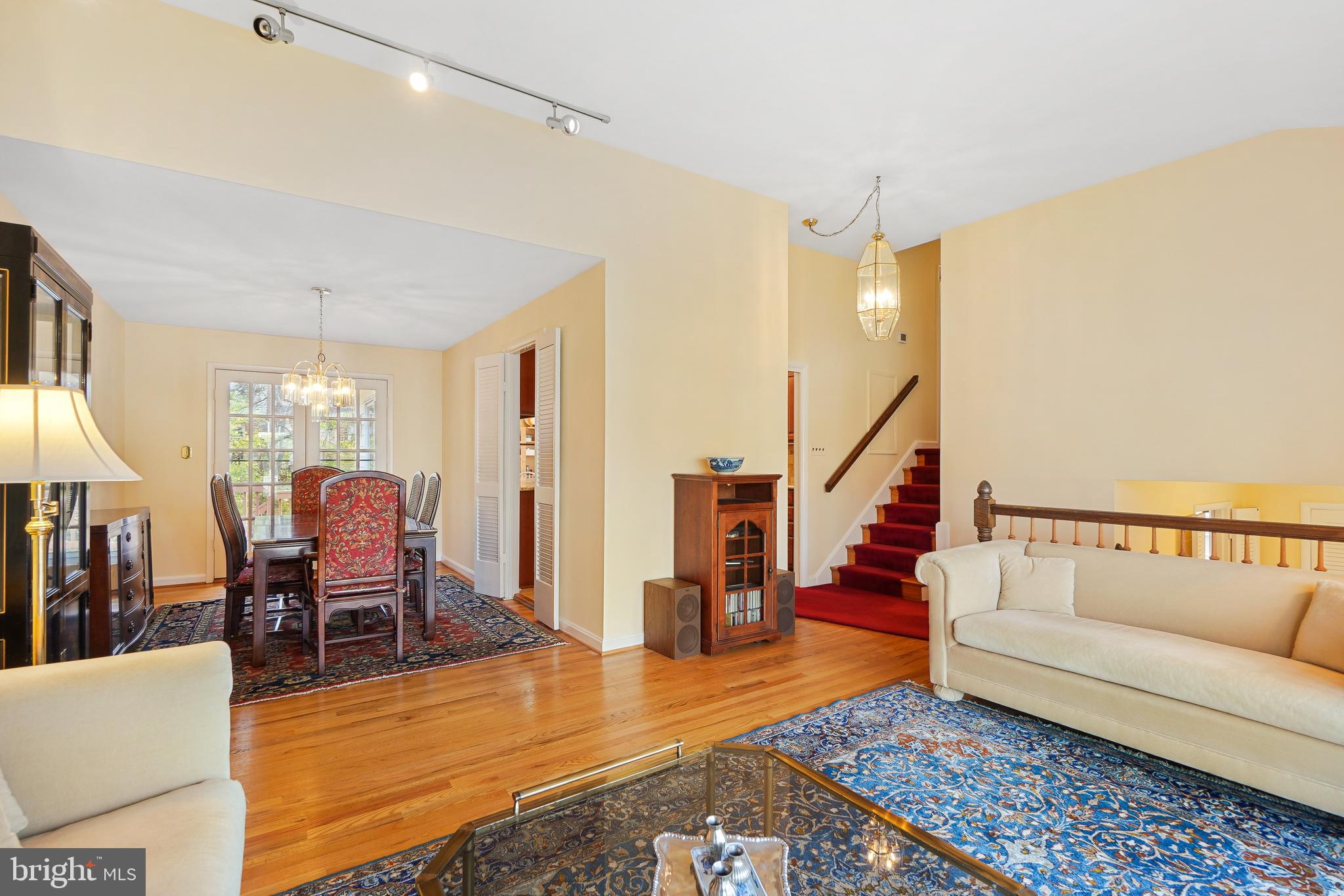 9127 Kirkdale Road Bethesda, MD 20817 - Photo 5 of 34 a living room with furniture and a dining table