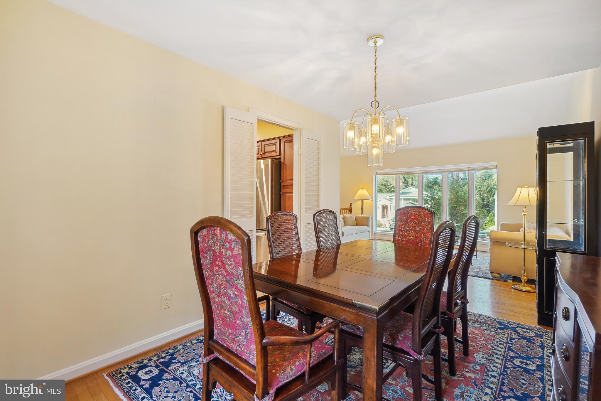9127 Kirkdale Road Bethesda, MD 20817 - Photo 7 of 34 a dining room with furniture a chandelier and window