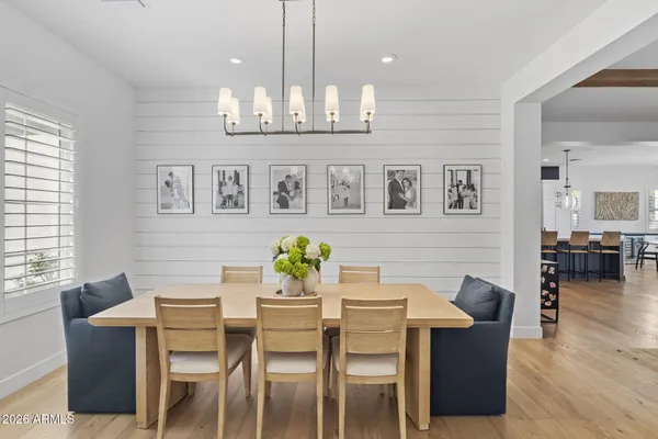 a view of a dining room with furniture and wooden floor