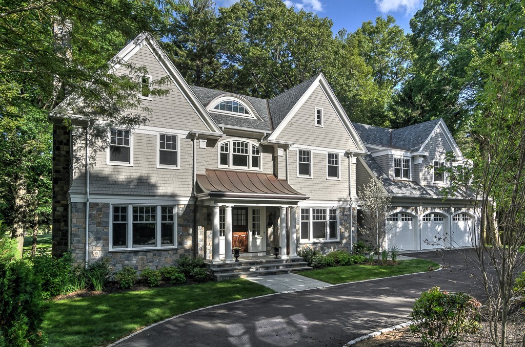 61 Lincoln Road Wellesley, MA 02481 - Photo 1 of 28 a front view of a house with a yard