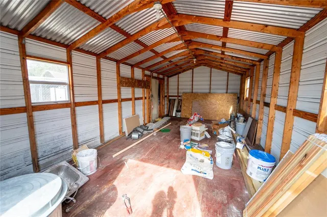 a view of a patio with a table and chairs