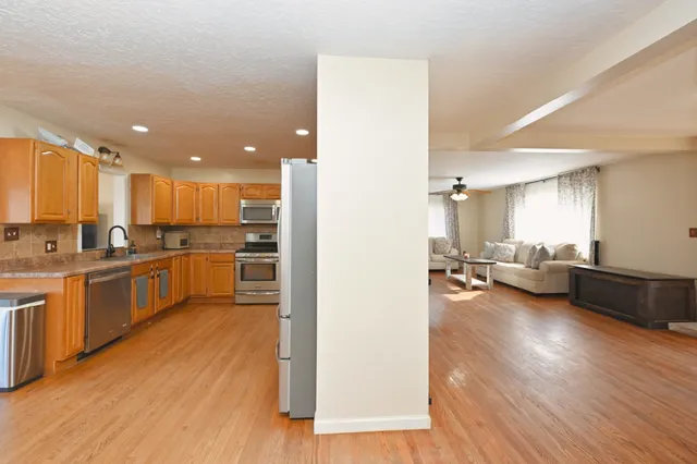 an aerial view of residential space with swimming pool and mountain view