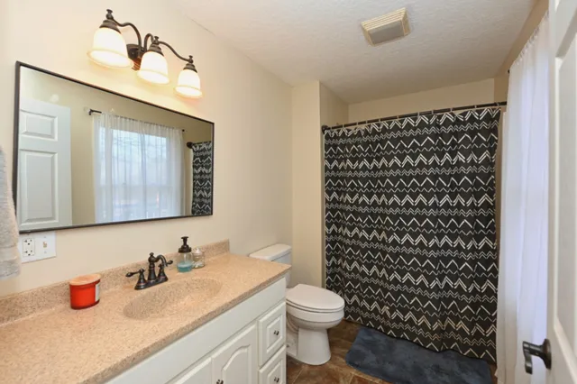 a view of a yard covered with snow