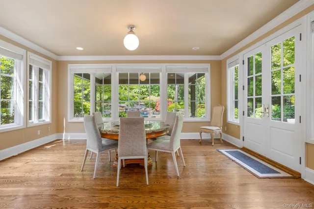 a view of a dining room with furniture window and outside view