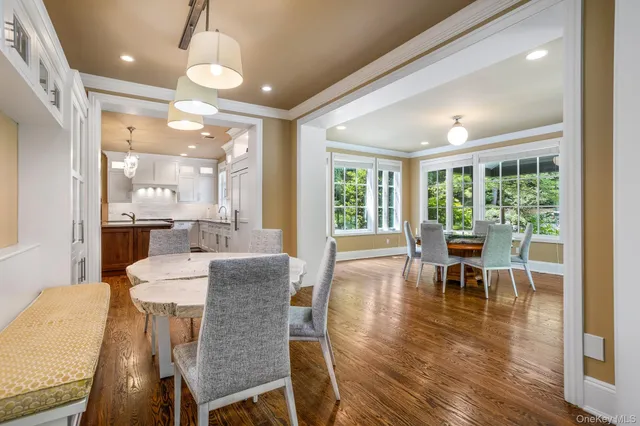 a dining room with furniture window wooden floor