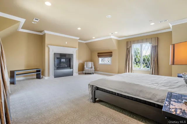 a spacious bedroom with a bed and a couch