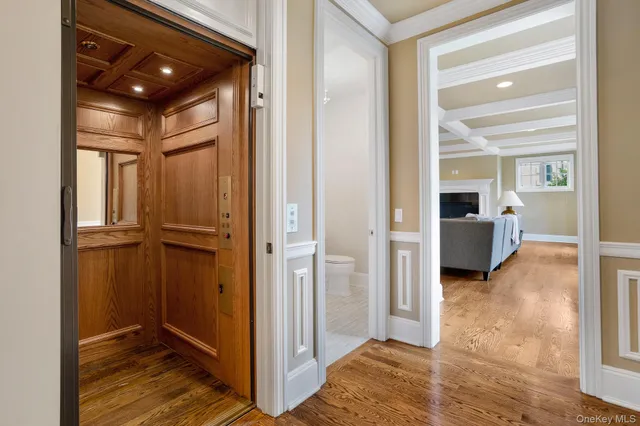 a view of a hallway with closet and livingroom view