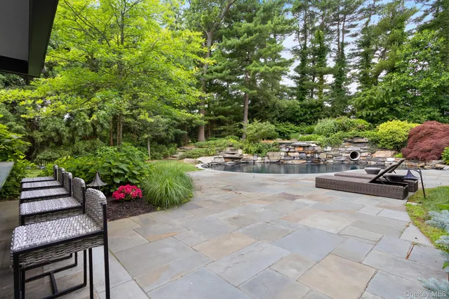 a garden view with a seating space