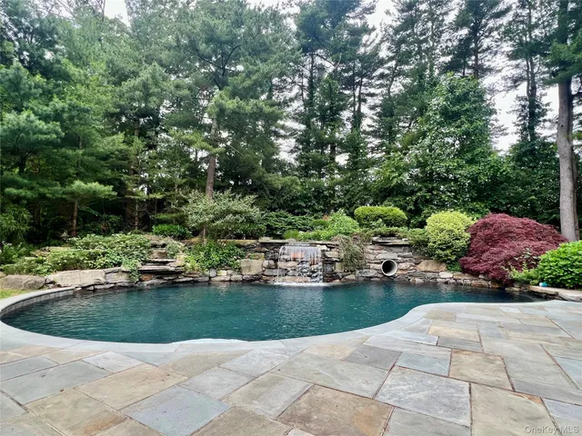 a view of a lake with sitting area
