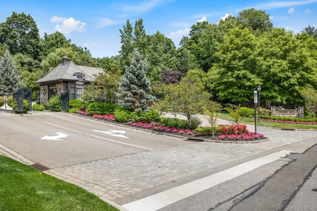 a view of a garden with flowers and trees